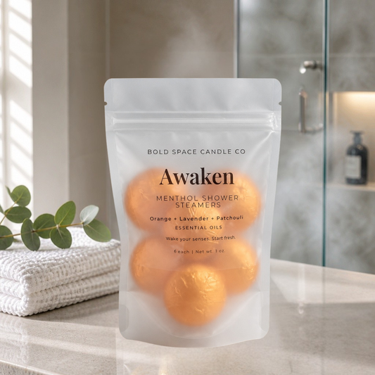 Pack of Awaken menthol shower steamers by Bold Space Candle Co on a bathroom counter.