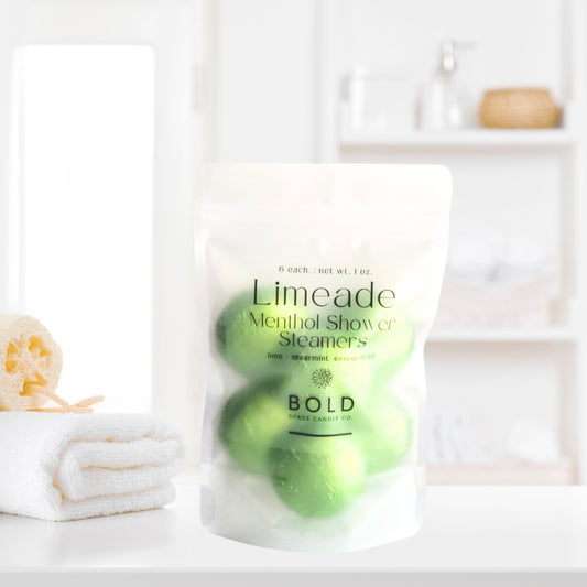 Lime and spearmint aromatherapy shower steamers styled in fresh spa bathroom decor