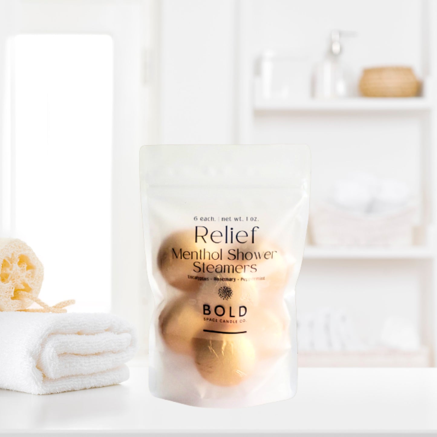 Relief aromatherapy shower steamers styled beside towels and spa bathroom accessories