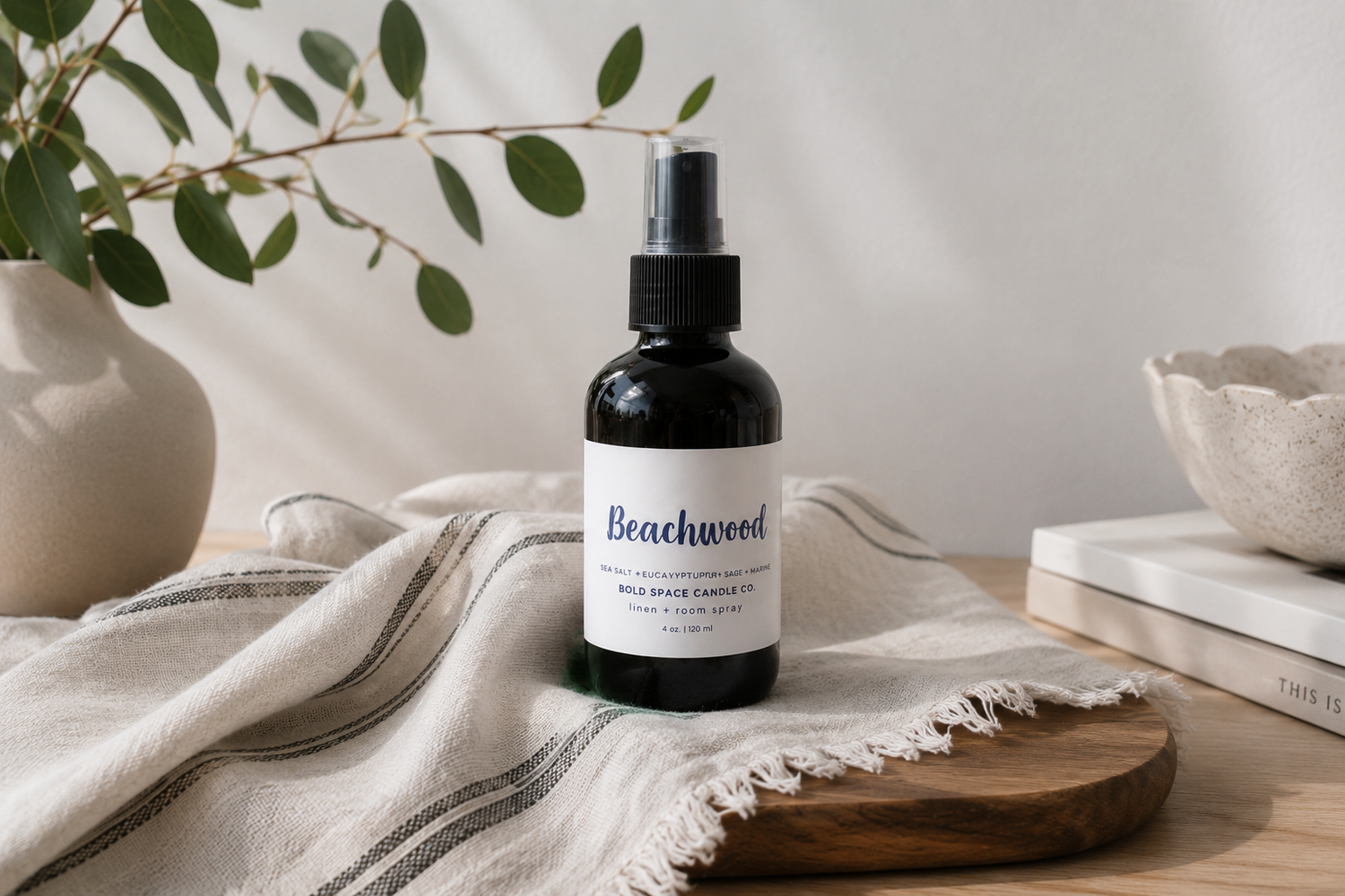 4 oz. Linen & Room Spray on a cozy counter with candle lit in background