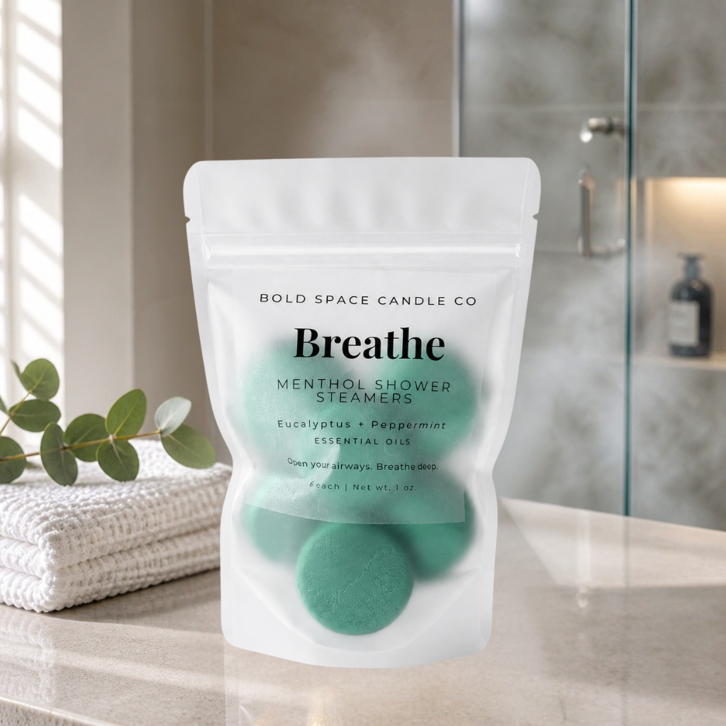 Package of Breathe mental shower steamers by Bold Space Candle Co on a bathroom counter.