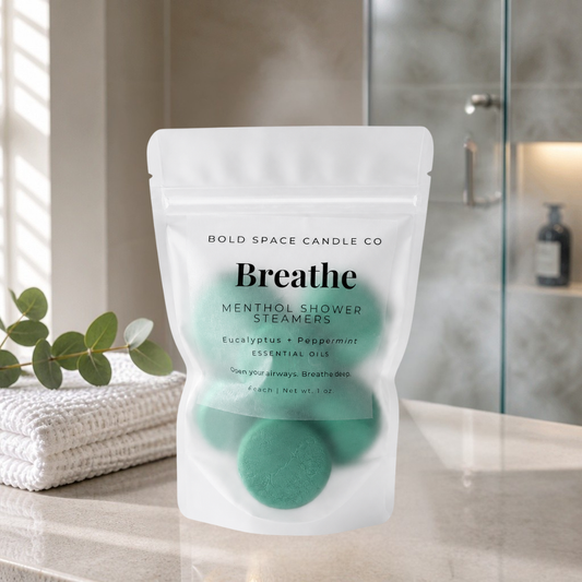 Package of Breathe mental shower steamers by Bold Space Candle Co on a bathroom counter.