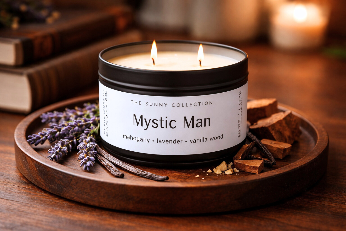 Candle labeled 'Mystic Man' from The Sunny Collection on a wooden tray with lavender and cinnamon sticks.