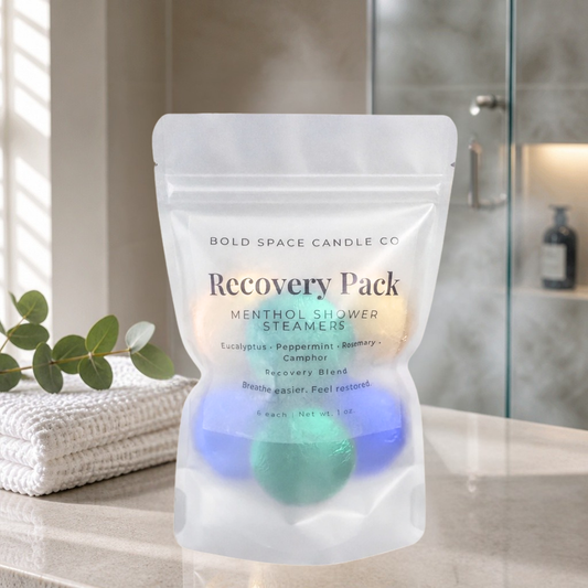Recovery Pack menthol shower steamers in a clear packaging on a bathroom counter.