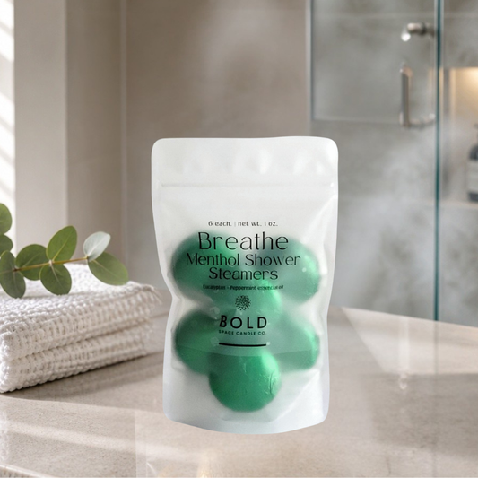 Package of Breathe Menthol Shower Steamers by Bold Space Candle Co. on a bathroom counter.