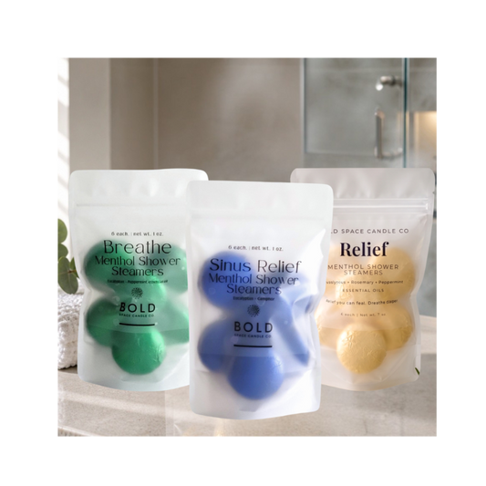Three packages of Menthol Shower Steamers on a bathroom counter.