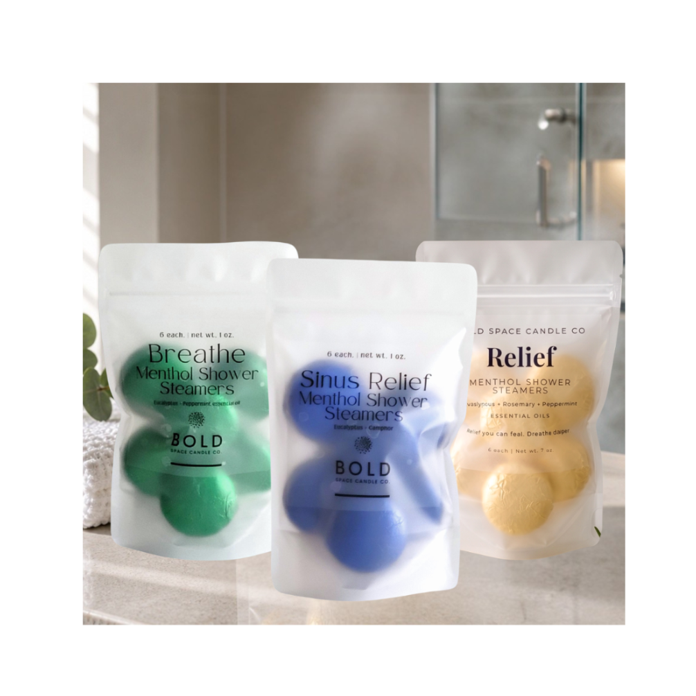 3 bundles of shower steamers on bathroom counter with steam from shower