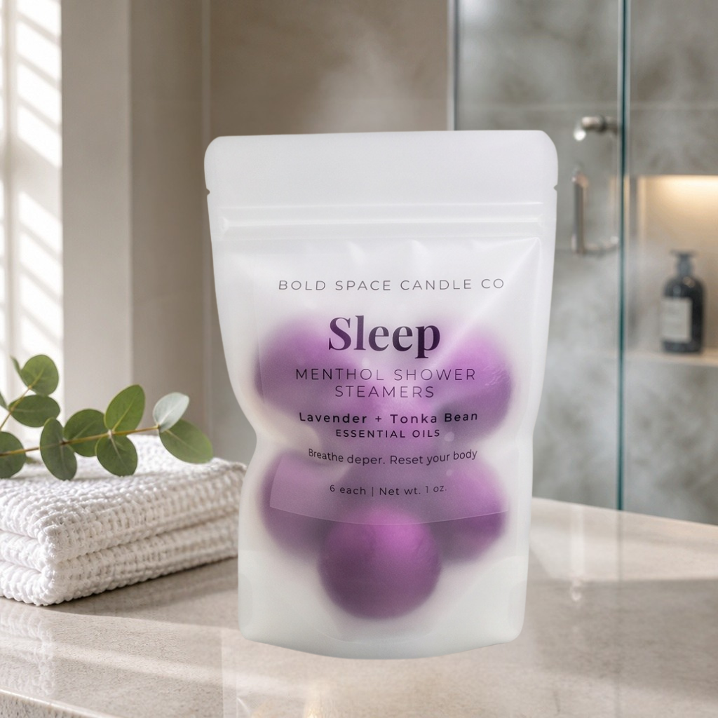 Pack of Sleep menthol shower steamers on a bathroom counter with a blurred background