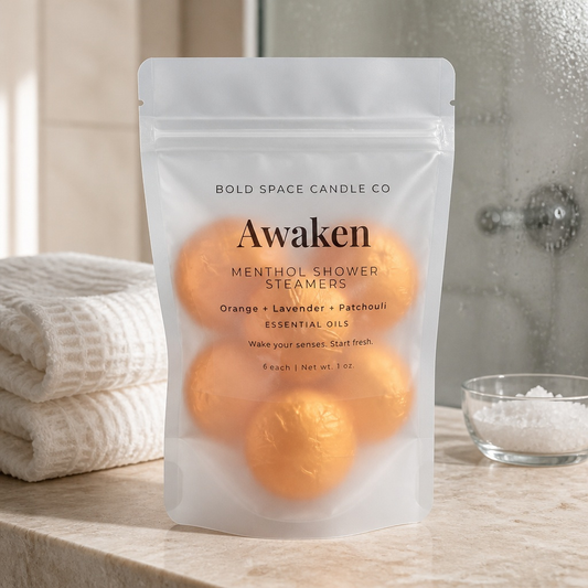 Pack of Menthol Shower Steamers labeled 'Awaken' by Bold Space Candle Co on a bathroom counter.