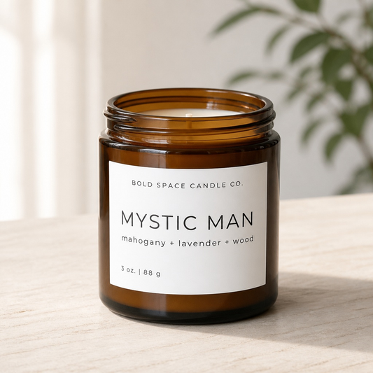 Candle jar labeled 'Mystic Man' from Bold Space Candle Co. on a neutral background.