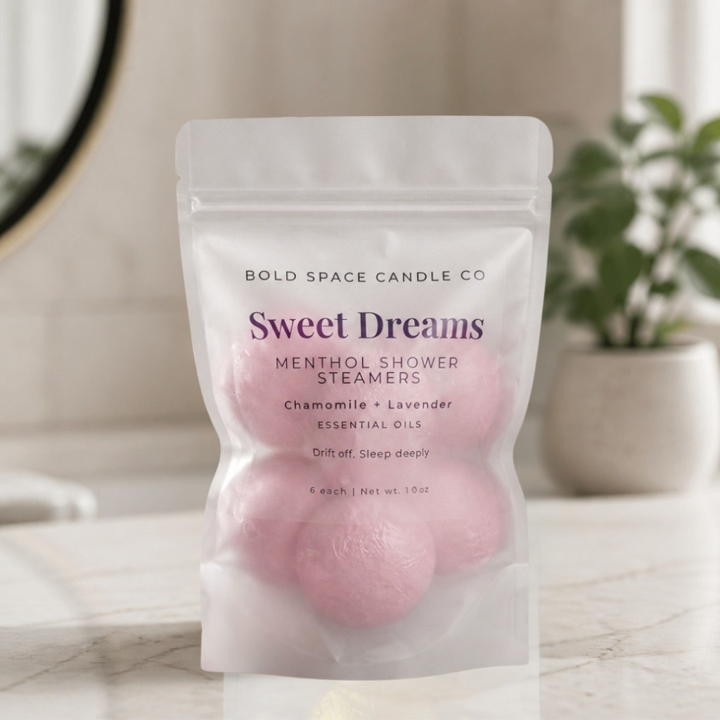 Package of 'Sweet Dreams' shower steamers by Bold Space Candle Co on a bathroom counter.